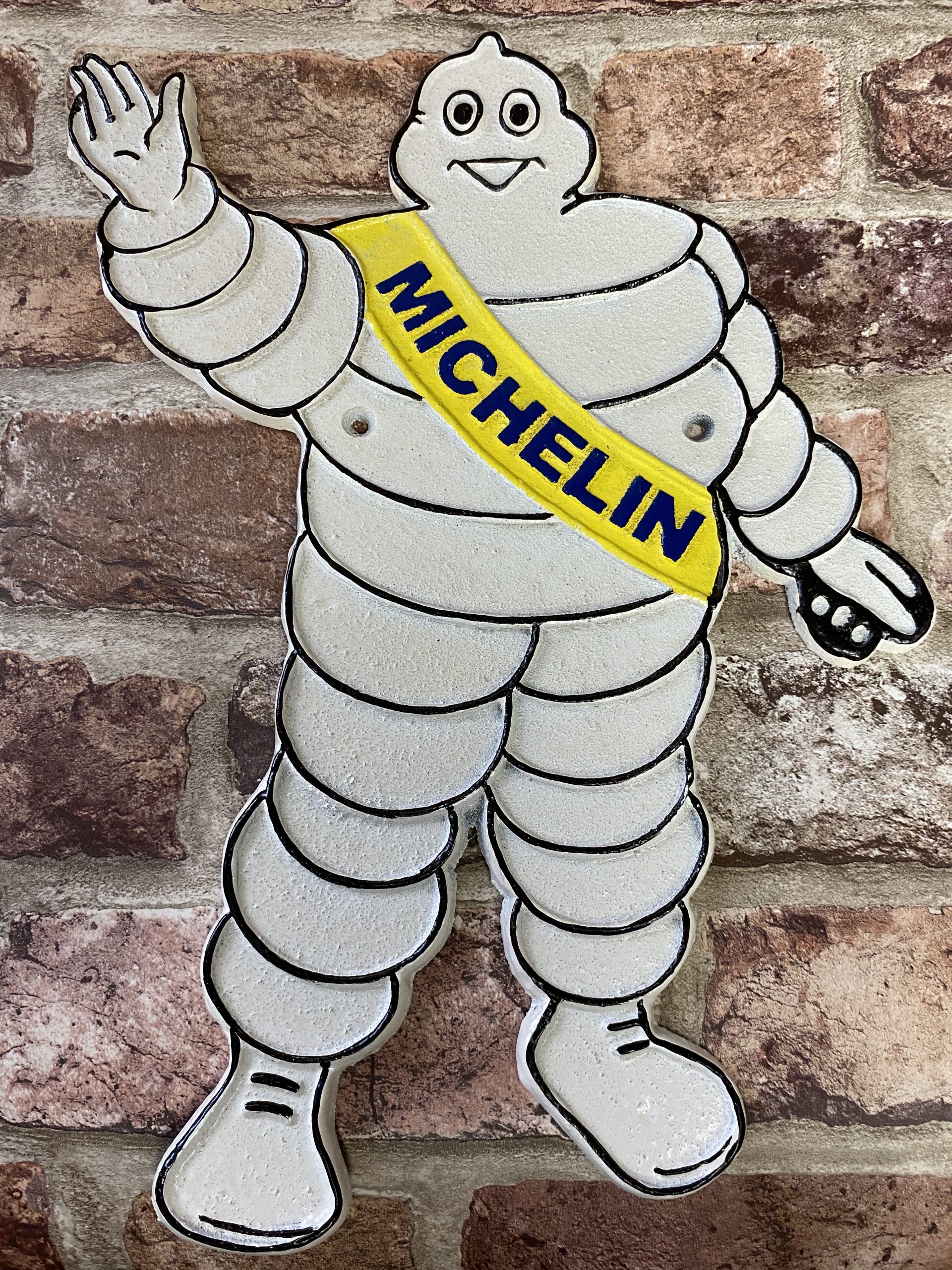 Cast Iron Wall Plaque Waving Michelin Man