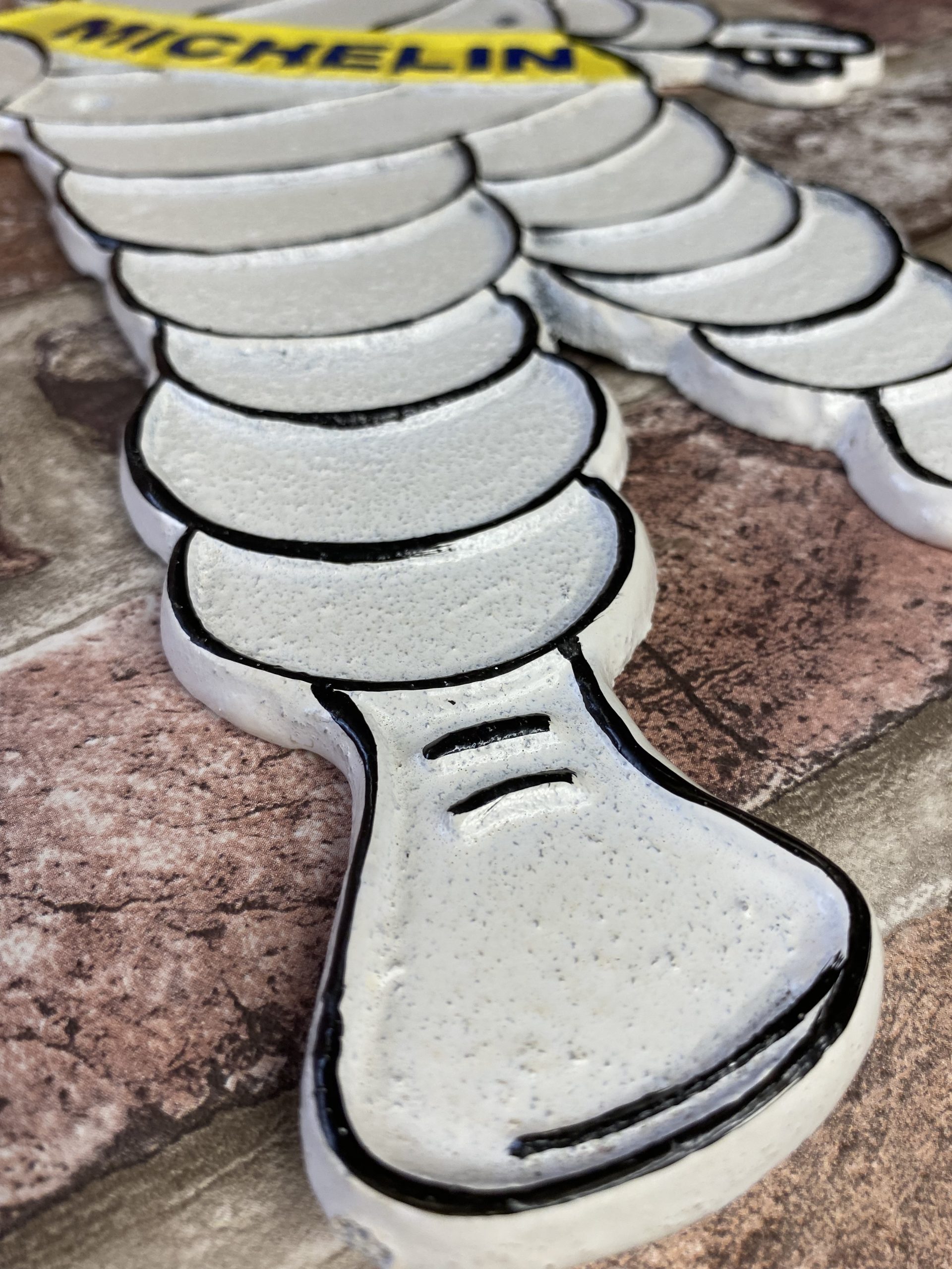 Cast Iron Wall Plaque Waving Michelin Man - Image 3